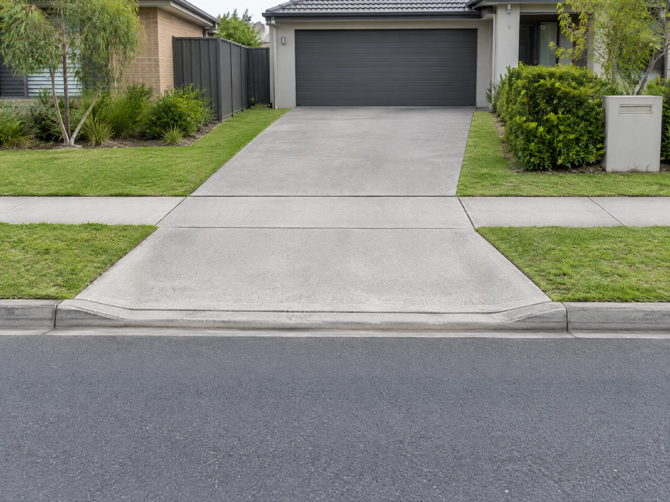 Illustrative residential concrete driveway crossing a public footway in NSW